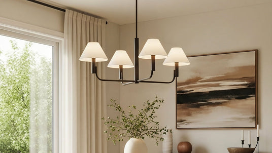 The Altair four light chandleier in Aged Iron hung in a transitional dining room with floor to ceiling drapery and contemporary art.
