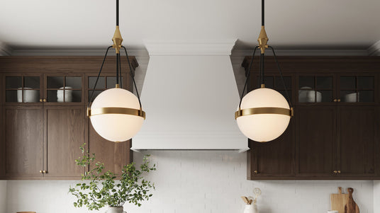 Two Darcy Large Pendant 18", Brushed Brass and Milk Glass in a transitional kitchen with dark walnut cabinets.