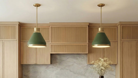 Two Drew Medium Pendants in Olive Green shown in a modern kitchen with fluted white oak cabinets.