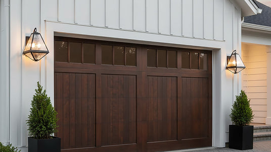 Two Emmett Outdoor Wall Light, Medium 17" Black Charcoal and water glass shown flanking a garage door
