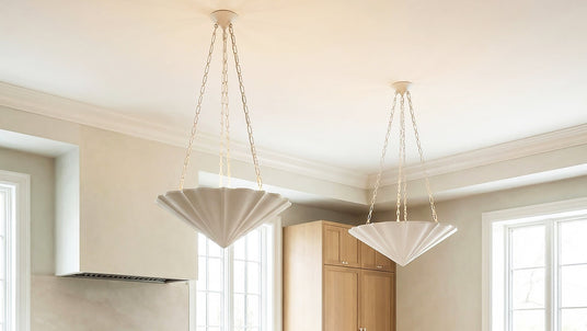 Two Cora 30" Pendants in Textured White hung in a organic modern styled kitchen.