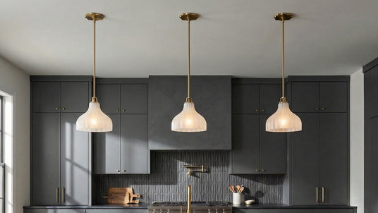 Three Small Claire 10" Pendants in a kitchen with slate gray cabinets.