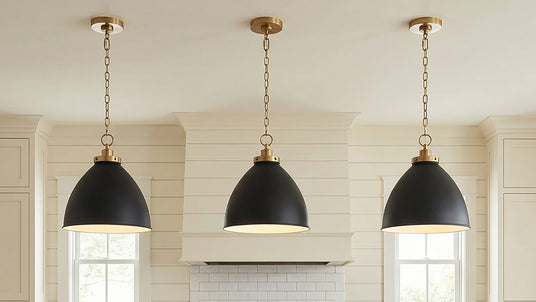 Three Rodney Medium Pendants in black and brass in a modern farmhouse kitchen