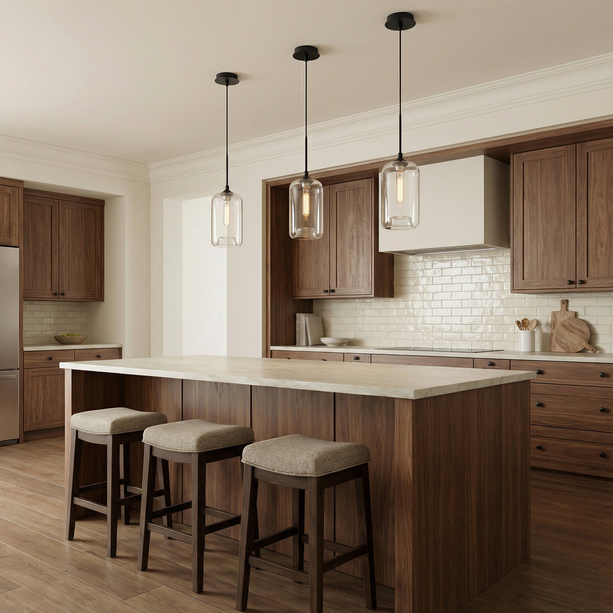 Windsor Heights Cylinder Glass Pendant 7" Matte Black geometric Pendant in a Transitional Kitchen with a dark wood kitchen island.