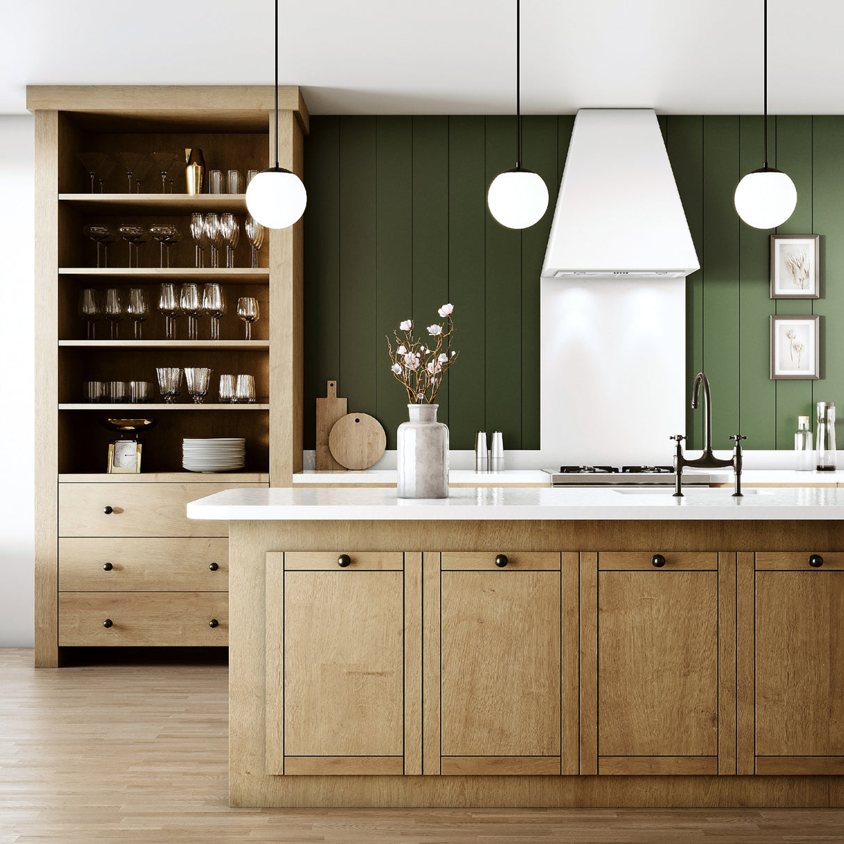 Three Castell LED 8" Globe Pendant Lights, Opal White Glass and Matte Black Metal Finish, hanging in a green kitchen with natural wood-tone cabinets