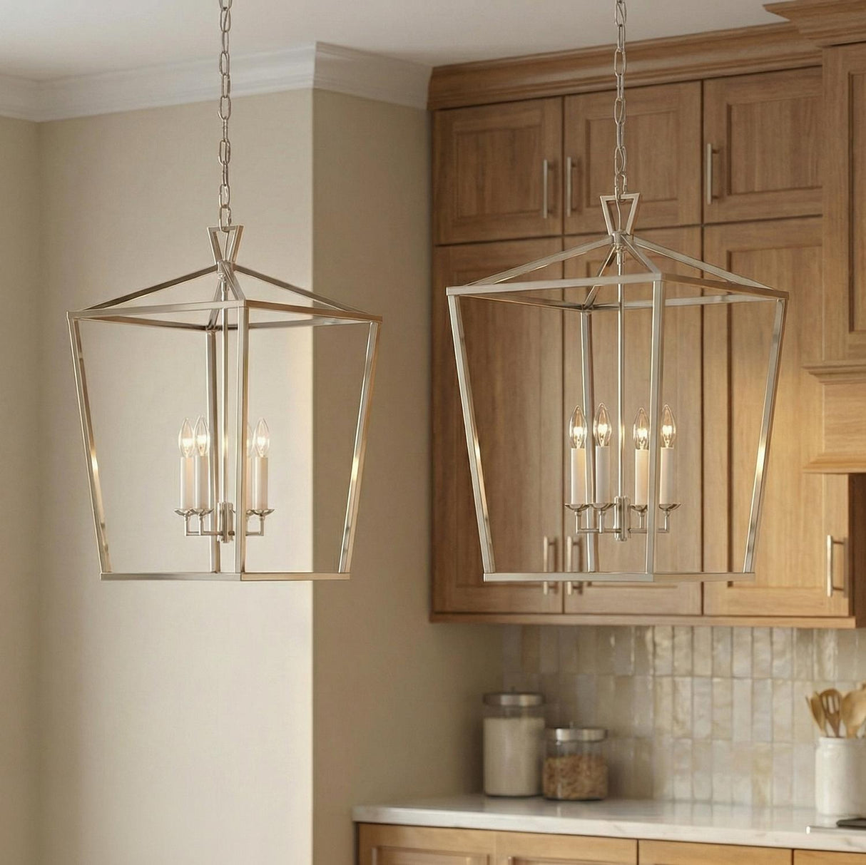 Polished Nickel geometric lantern pendant in a Transitional Kitchen with warm wood cabinets and a marble countertop.