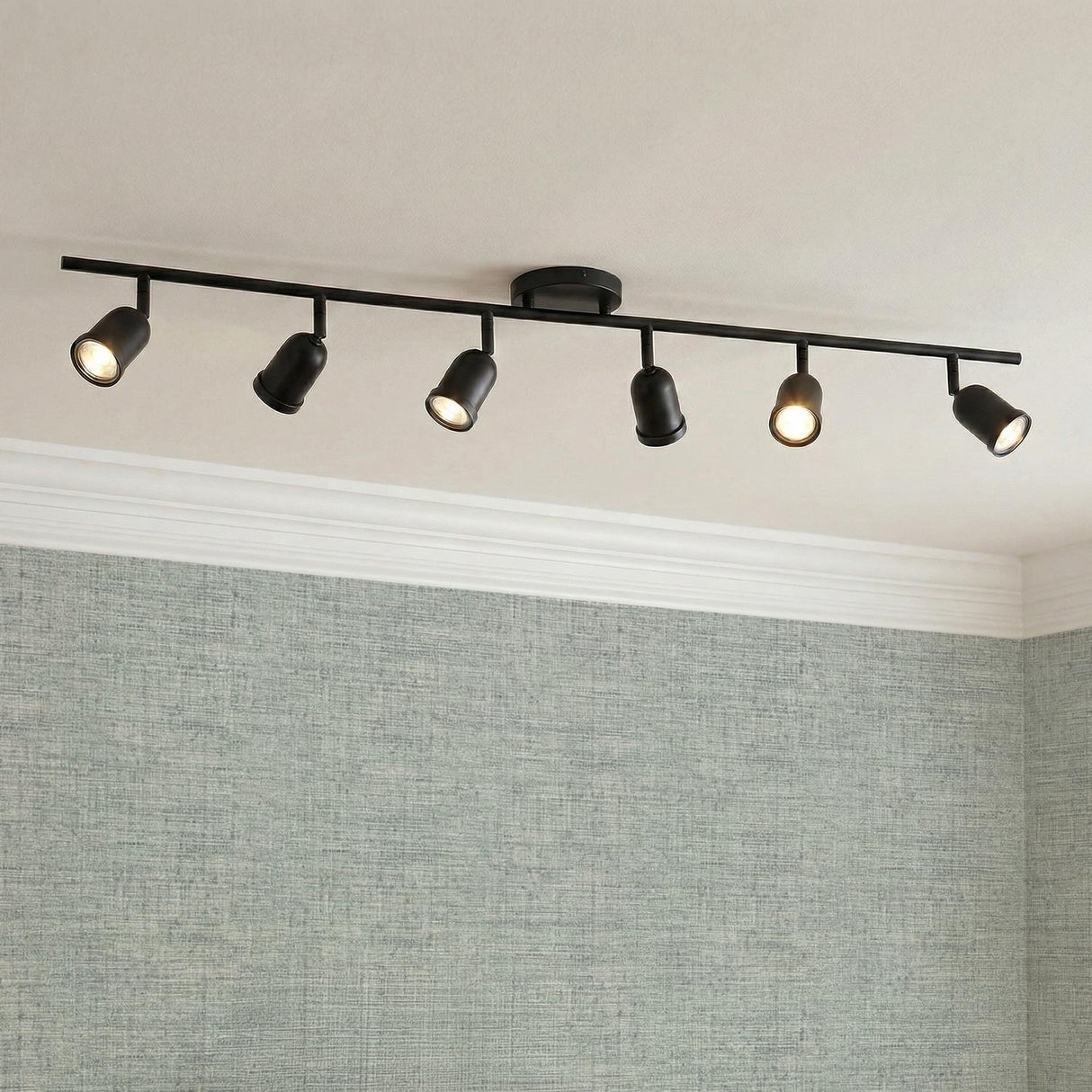 Bixby 44" 6-Light Fixed Track Light, Matte Black linear Fixed Track Light in a Modern Office with textured sage wallpaper.