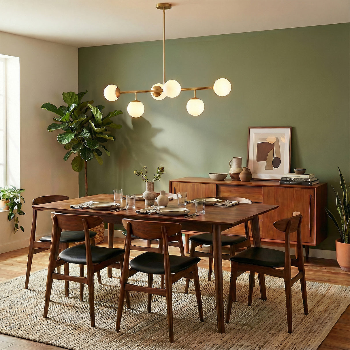 Castell 6 Globe Linear Pendant 46", Brass globe linear pendant in a Mid-Century Dining Room with a wooden dining table and green accent wall.