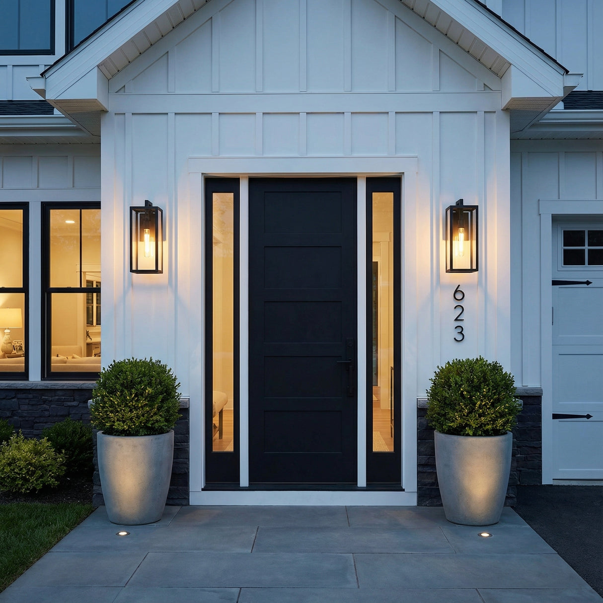 Sam Outdoor Wall Light, Medium 18" Matte Black geometric outdoor wall sconce in a Modern Farmhouse Outdoor with board-and-batten siding and black door.