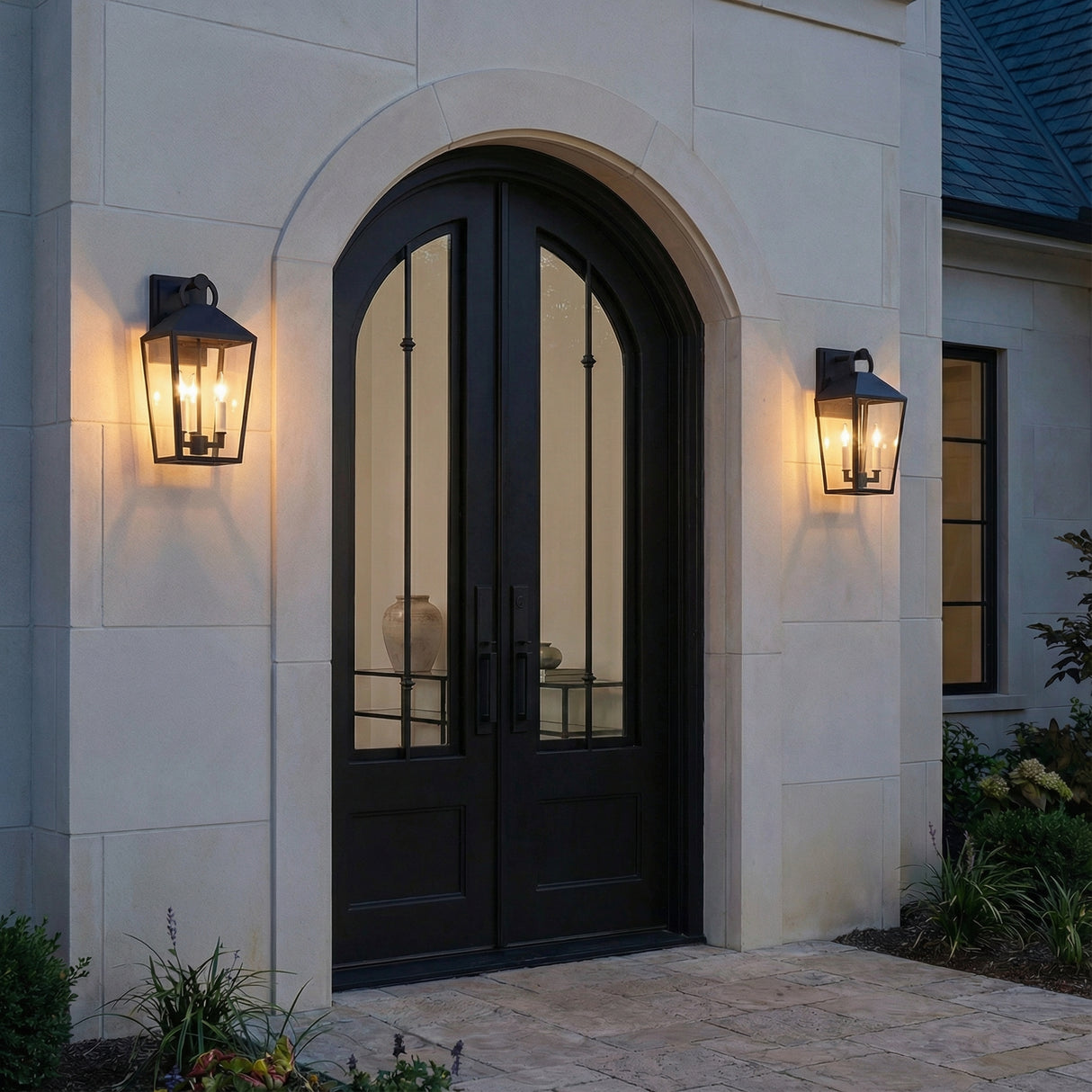 Cole Outdoor Wall Light, Medium 17" Black geometric Outdoor Wall in a Transitional Outdoor with a stone wall and arched doors.