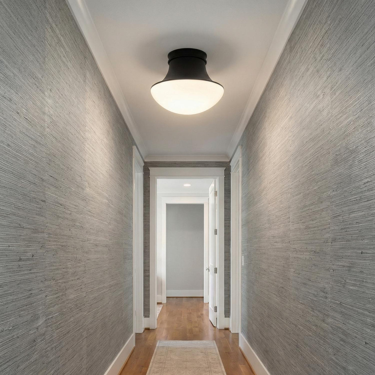 Jayden Flush Mount 14", Matte Black geometric flush mount in a Transitional Hallway with grey grasscloth wallpaper and white trim.