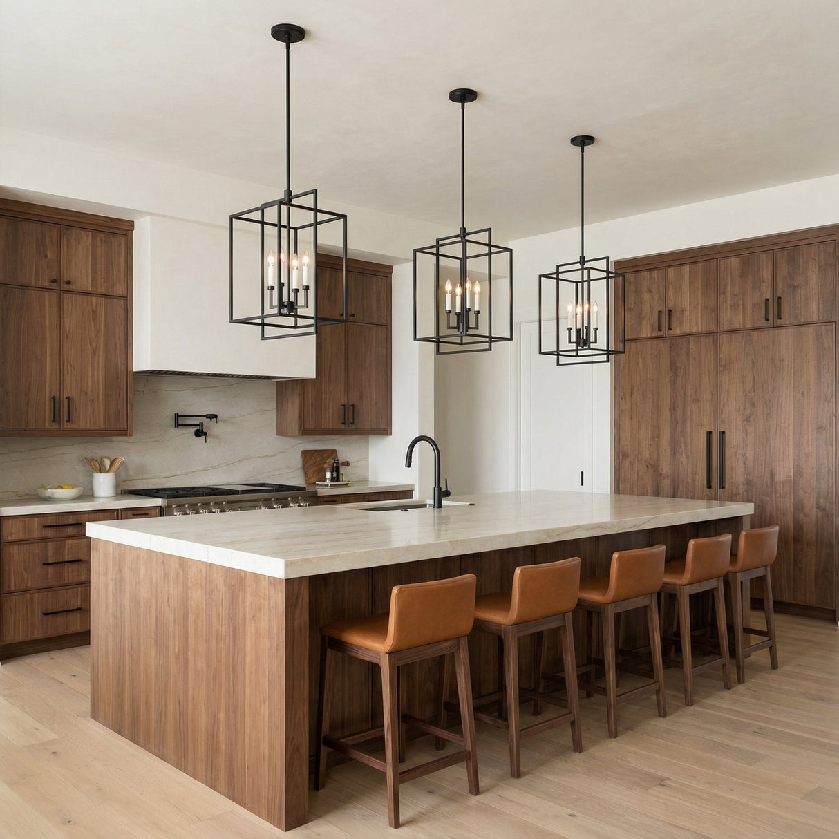 Matte Black with White geometric pendant in a Transitional Kitchen with a marble island and leather bar stools.