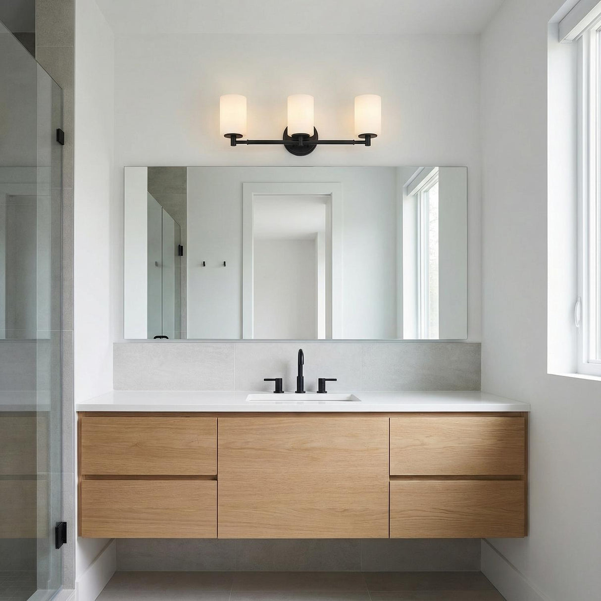 Becca 3 Light Vanity, Matte Black geometric vanity light in a Modern Bathroom with a floating wood vanity.