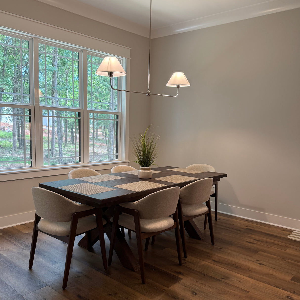Holden is shown in polished nickel finish above a 7 foot long rectangular dining table. Customer image courtesy of Angela B.
