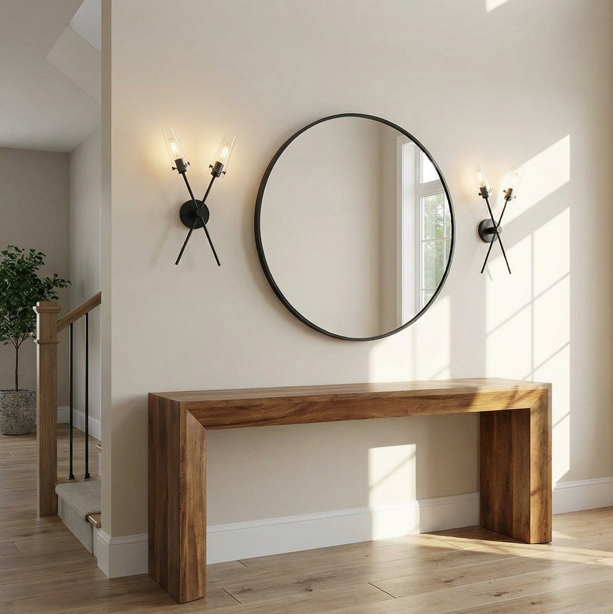 Matte Black geometric wall sconce in a Modern Entryway with a wood console table and round mirror.