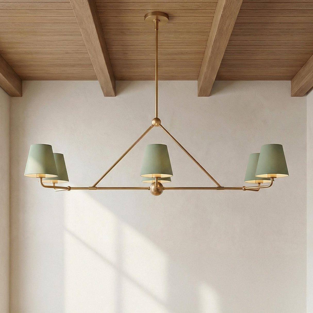 Banks 6 Light Linear Chandelier 46", Sage Green and Brass linear Chandelier in a Modern Farmhouse Dining Room with a wood beam ceiling.