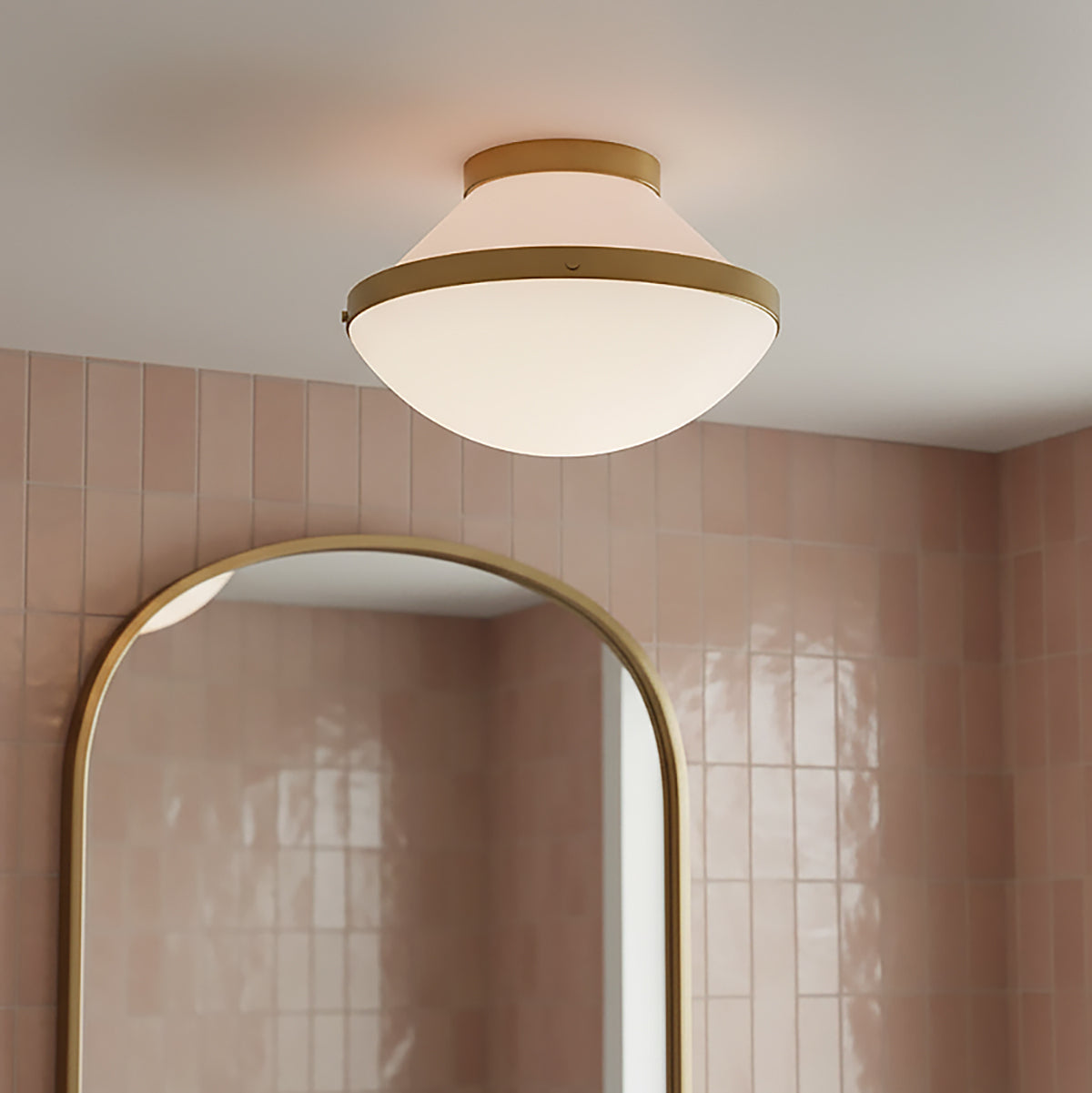 Blush tiled bathroom with the Blair Flush Mount 12" ceiling light, Pink Quartz and Brass.