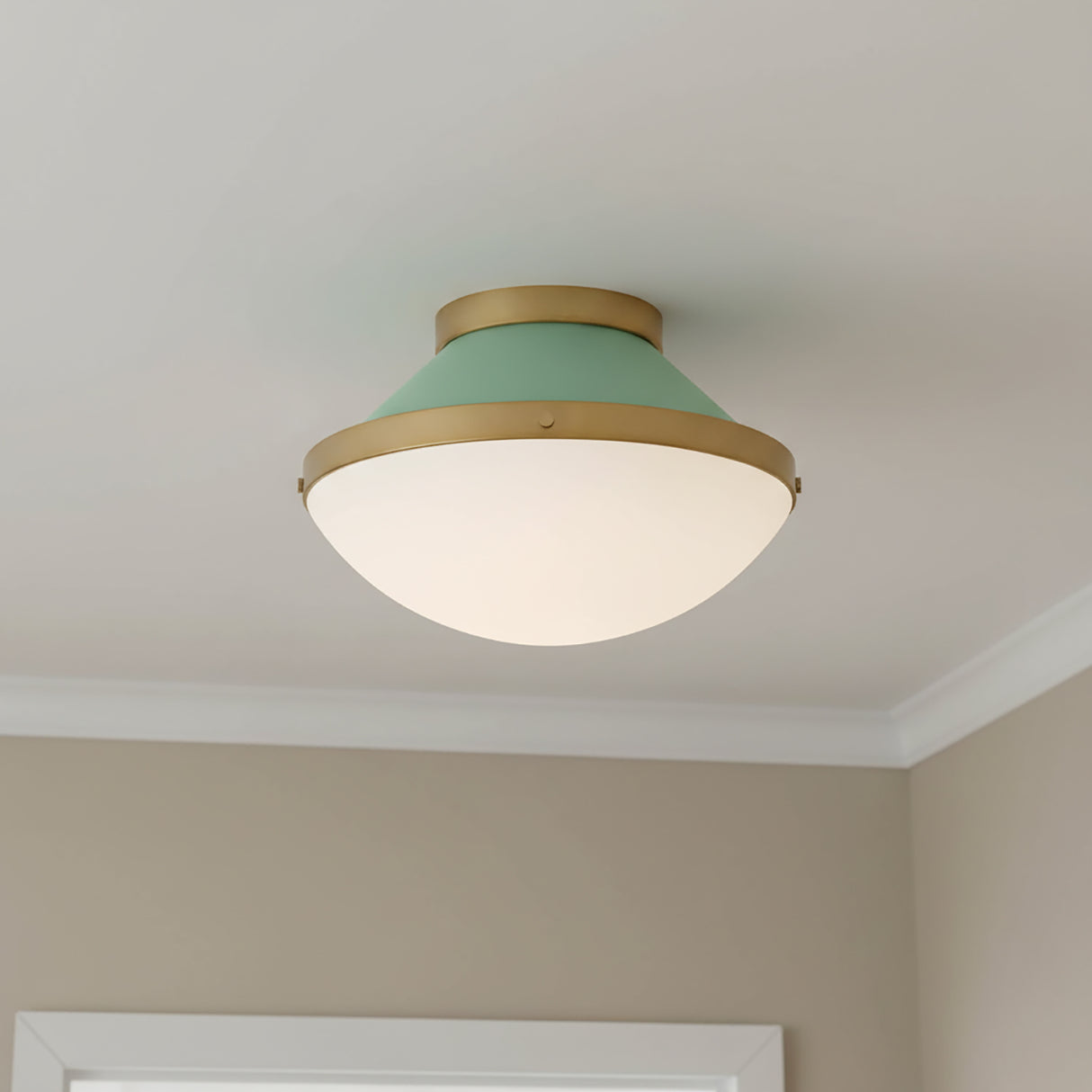 Blair Flush Mount 12" ceiling light, Sage Green and Brass finish, shown in a room with taupe walls and a white ceiling.