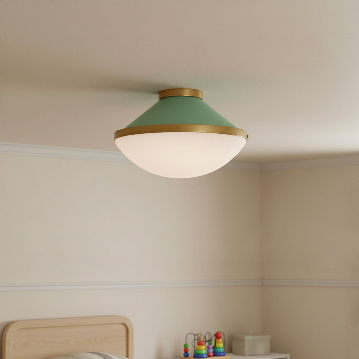 Blair Flush Mount 16, Sage Green and Brass - A green and brass flush mount ceiling light is installed in a bedroom.