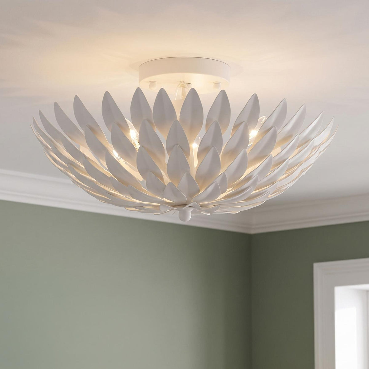 A contemporary room featuring the Alysa Semi-Flush 16", Matte White fixture mounted on the ceiling above soft sage green walls with crisp white crown molding.