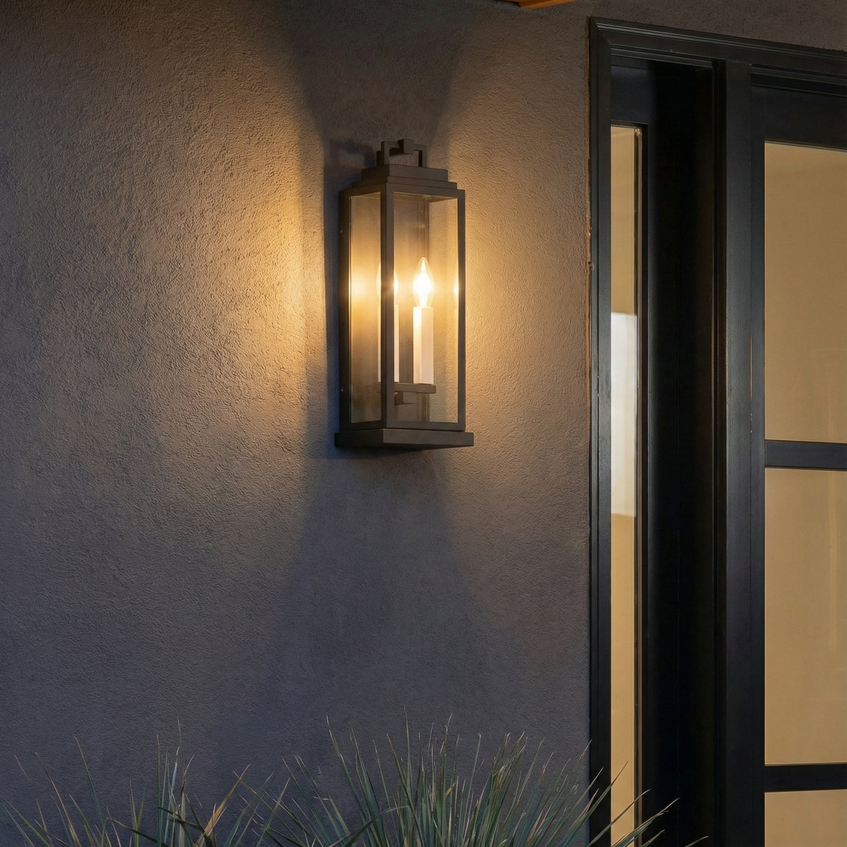 Easton Outdoor Wall Light, Medium 19" Black linear outdoor wall light in a Transitional Outdoor setting with dark stucco wall.