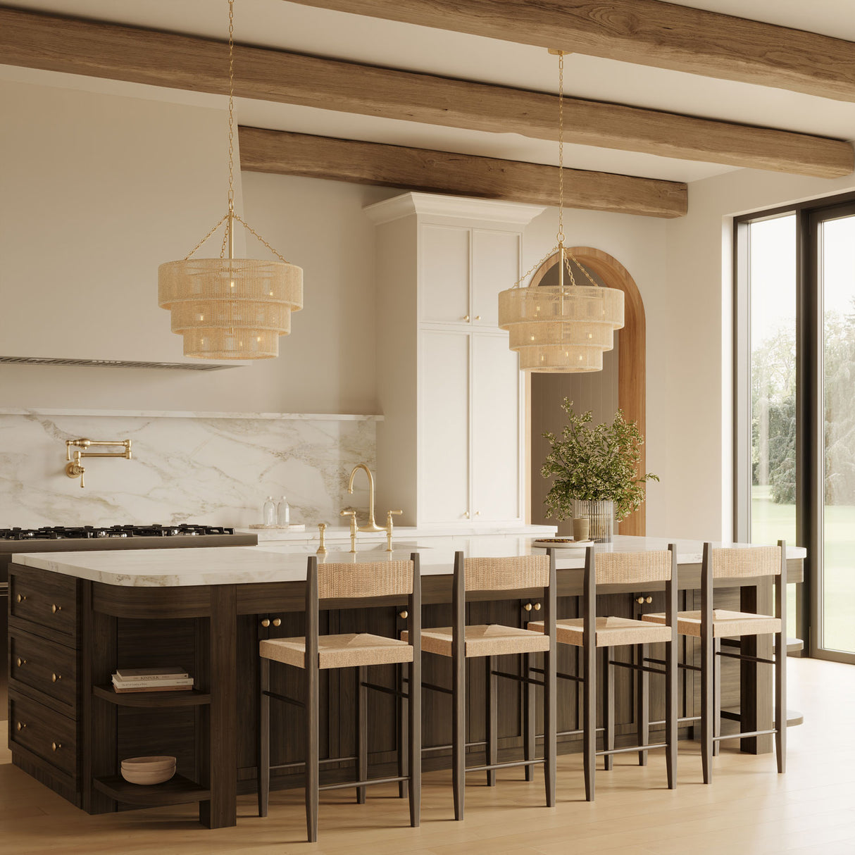 Two Sorelle 10 Light Jute Chandeliers hung above a grand kitchen island with dark wood, white upper cabinets, and exposed beams on the ceiling.
