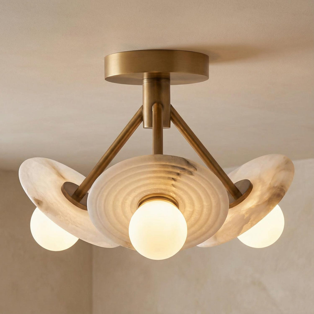 Bren LED Semi-Flush 13", Vintage Brass and Alabaster scalloped Flush Mount in a Contemporary Entryway with textured plaster walls.