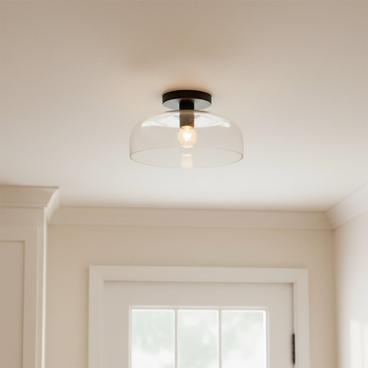 Bella Semi-Flush 12, Matte Black - Flush mount light with clear dome shade, matte black base and exposed bulb centered on white ceiling.