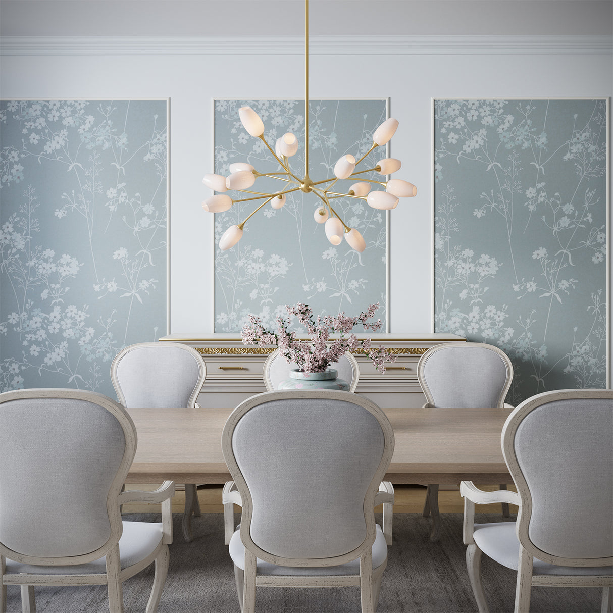Dining room with the Amara 44" chandelier, table, and chairs against a blue and white floral wallpaper.
