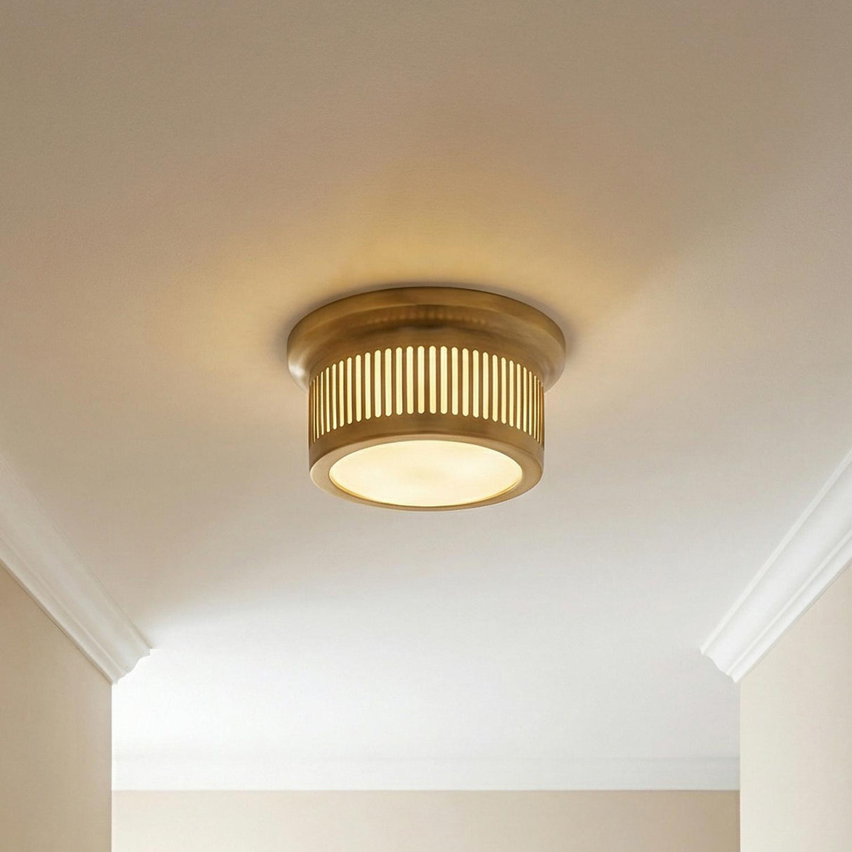 Vann Aged Brass geometric linear flush mount in a Transitional Hallway with white crown molding.