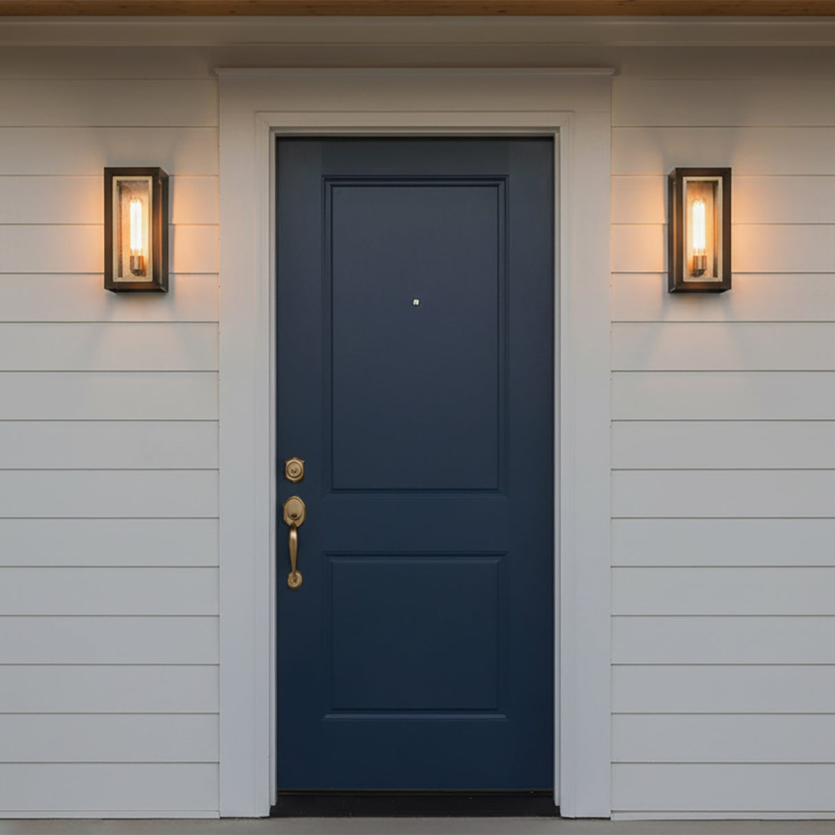 Wesley Outdoor Wall Light, Medium 17" Bronze with Vintage Brass Accents - Two wall sconces flanking a navy blue front door