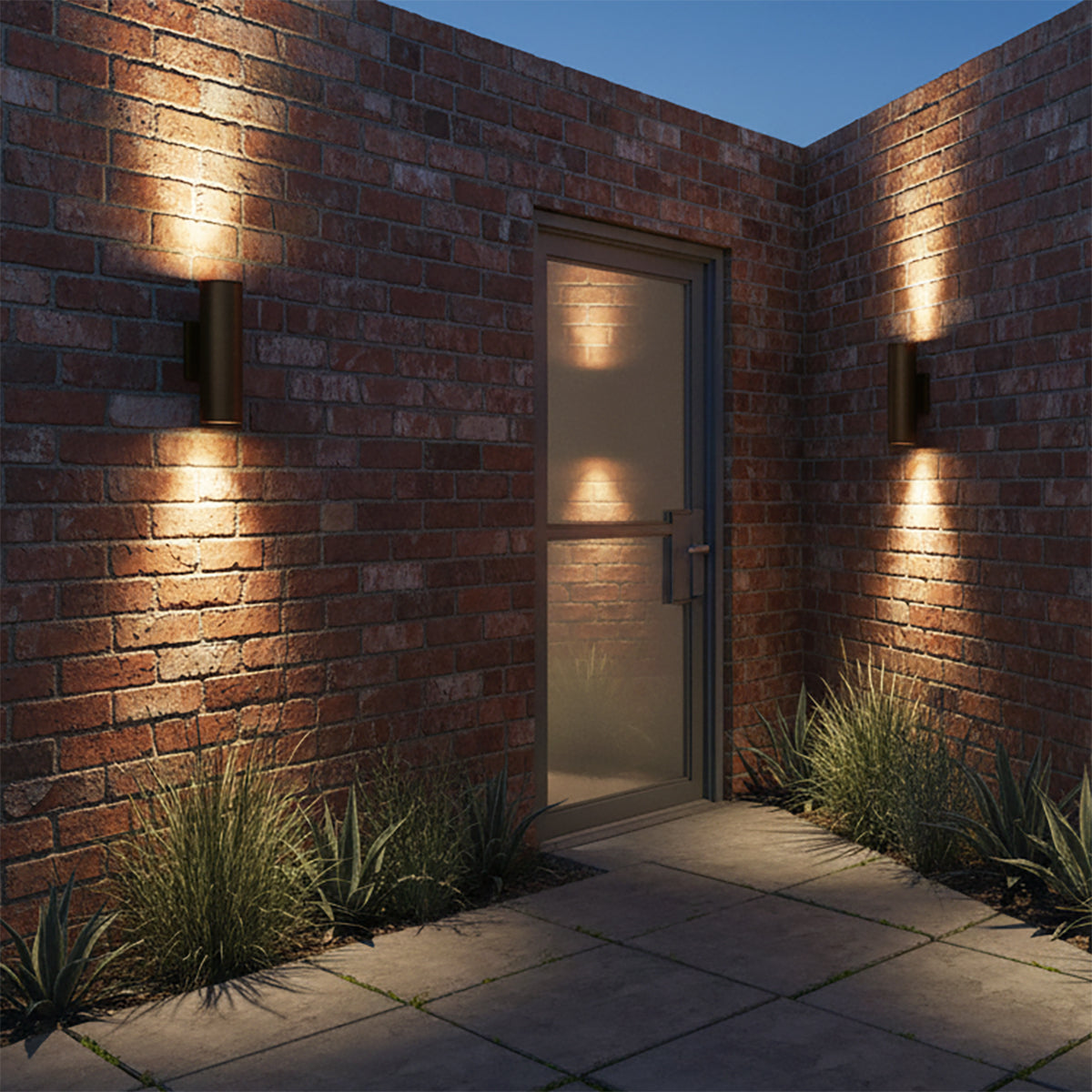 Beck Outdoor Cylinder Wall Light, 15" Black - Two cylinder lights flanking a door on a brick wall