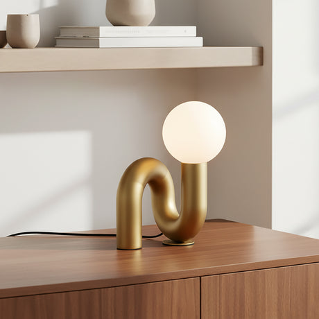 Mimi Petit Table Lamp, Brushed Brass on a wooden console with neutral modern decor.