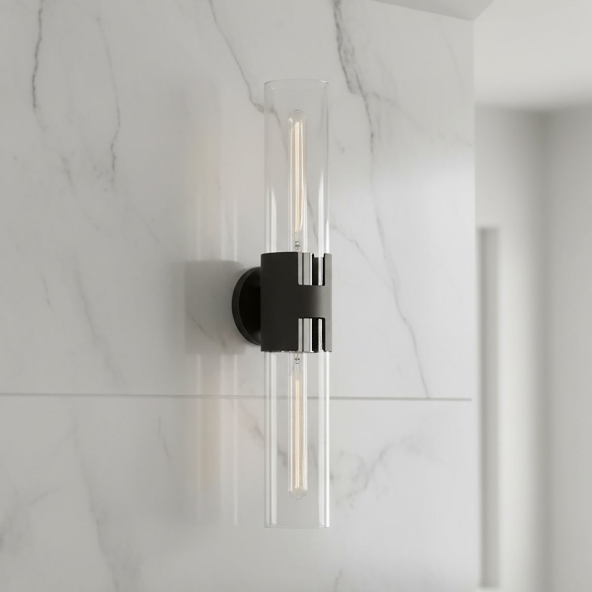 James 2 Light Wall Sconce 26, Black and Polished Nickel - A black and polished nickel wall sconce with two clear glass tubes, mounted on a white marble wall.