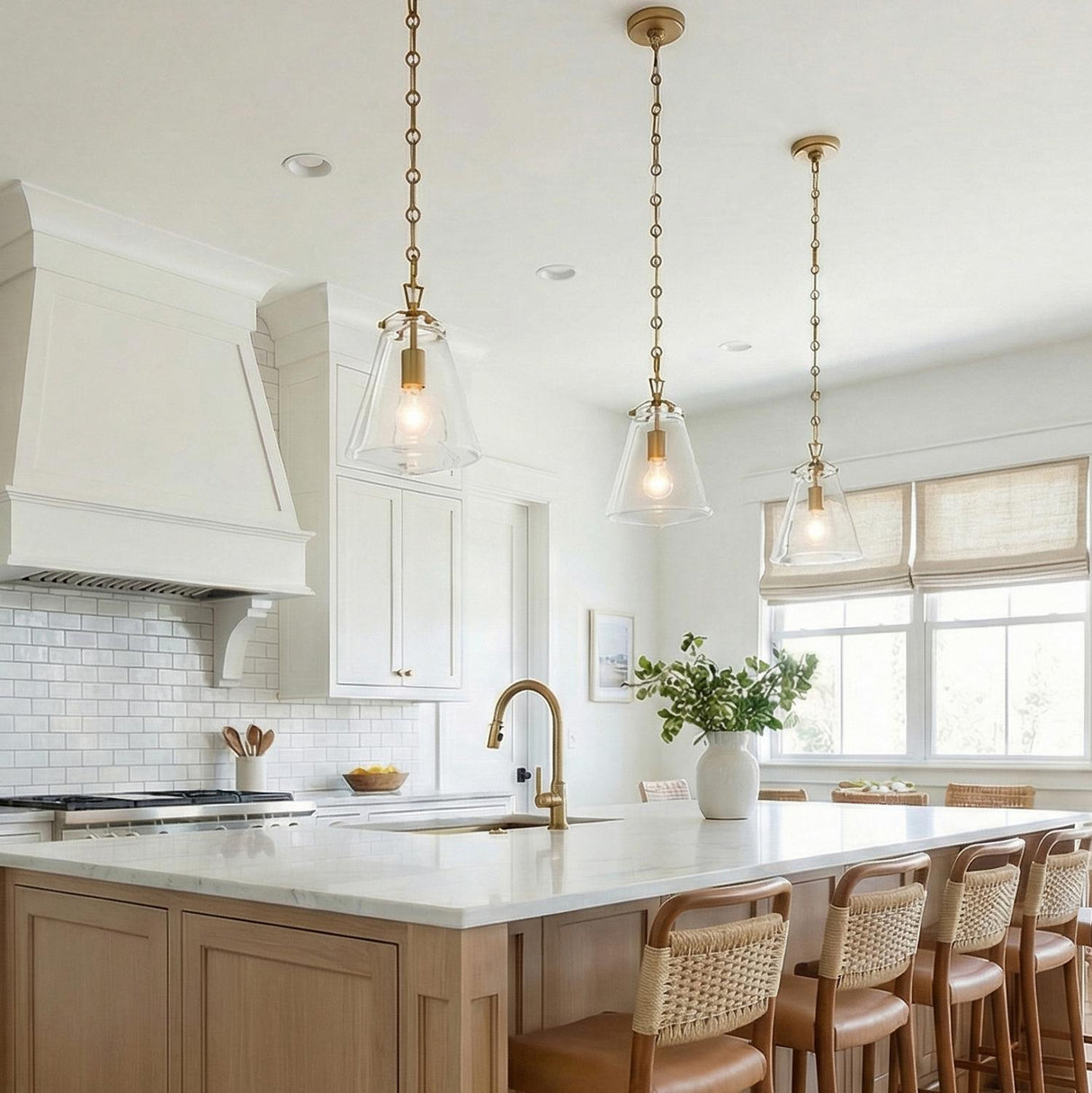 Addison Brass geometric pendant in a Modern Farmhouse Kitchen with a white marble island and woven bar stools.