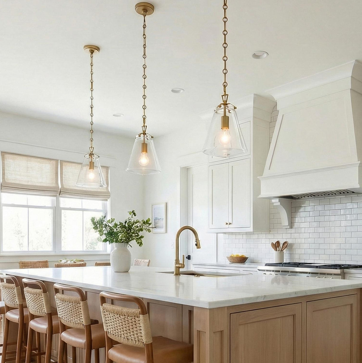 Addison Brass geometric pendant in a Modern Farmhouse Kitchen with a white marble island and woven bar stools.