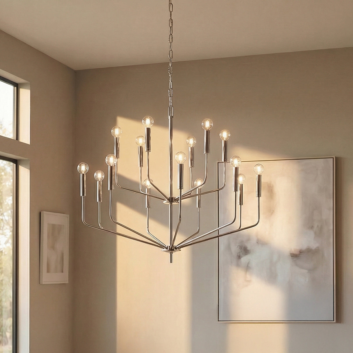 Hollis 15 Light Two-Tier Chandelier 36", Polished Nickel geometric chandelier in a Modern Living Room with abstract wall art.