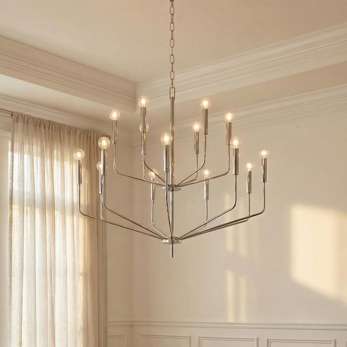 Hollis 15 Light Two-Tier Chandelier 36", Polished Nickel geometric chandelier in a Transitional Living Room with sheer linen curtains.