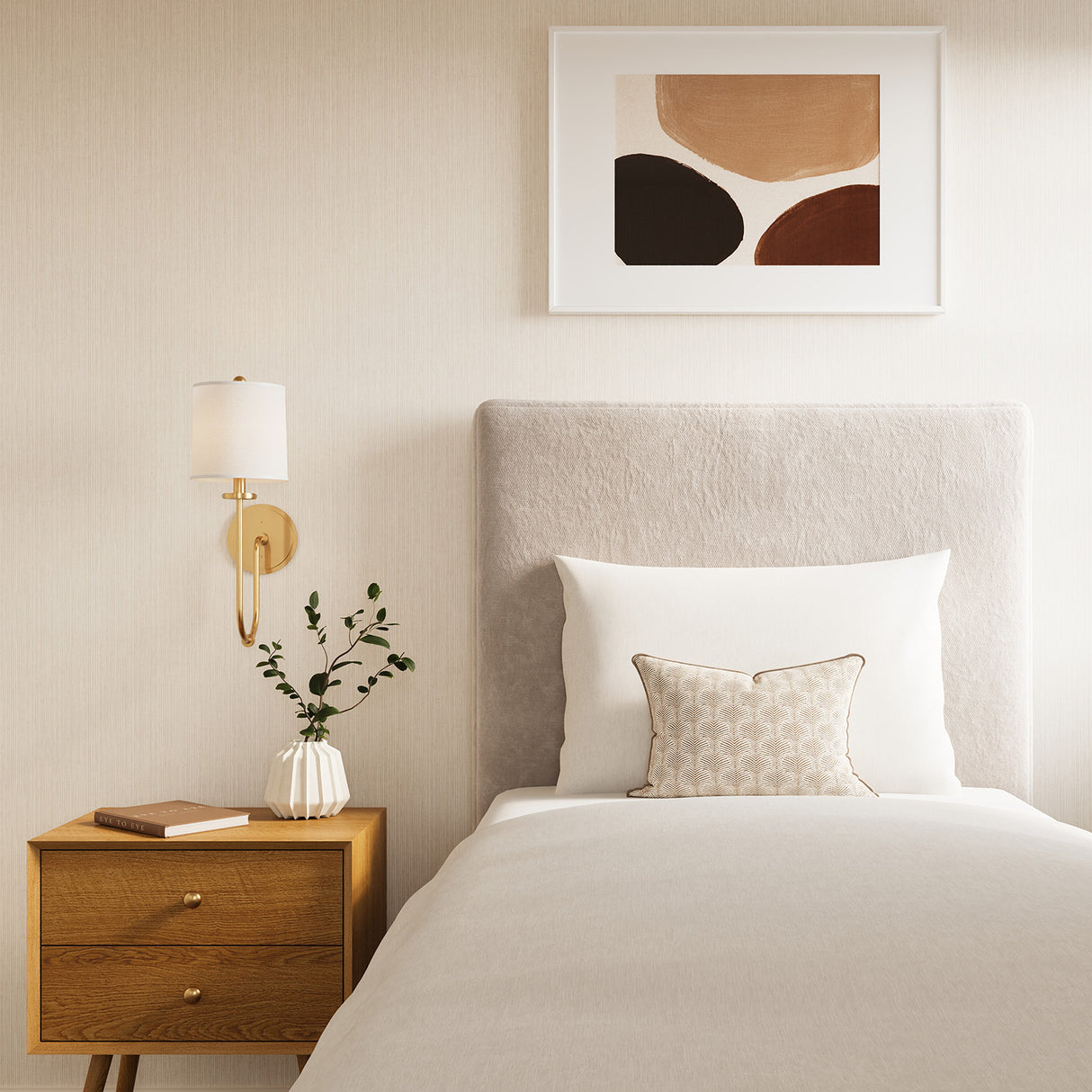 Hayden Wall Sconce 21" tall with Brass finish and white fabric shade shown as a bedside light next to a twin bed and wooden MCM nightstand.