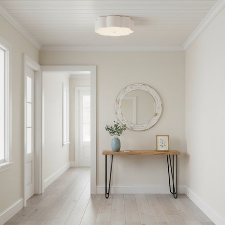 Shana Flush Mount 14, Antique White - A white flower-shaped flush mount light fixture illuminates a bright and airy hallway with light wood floors and a console table.