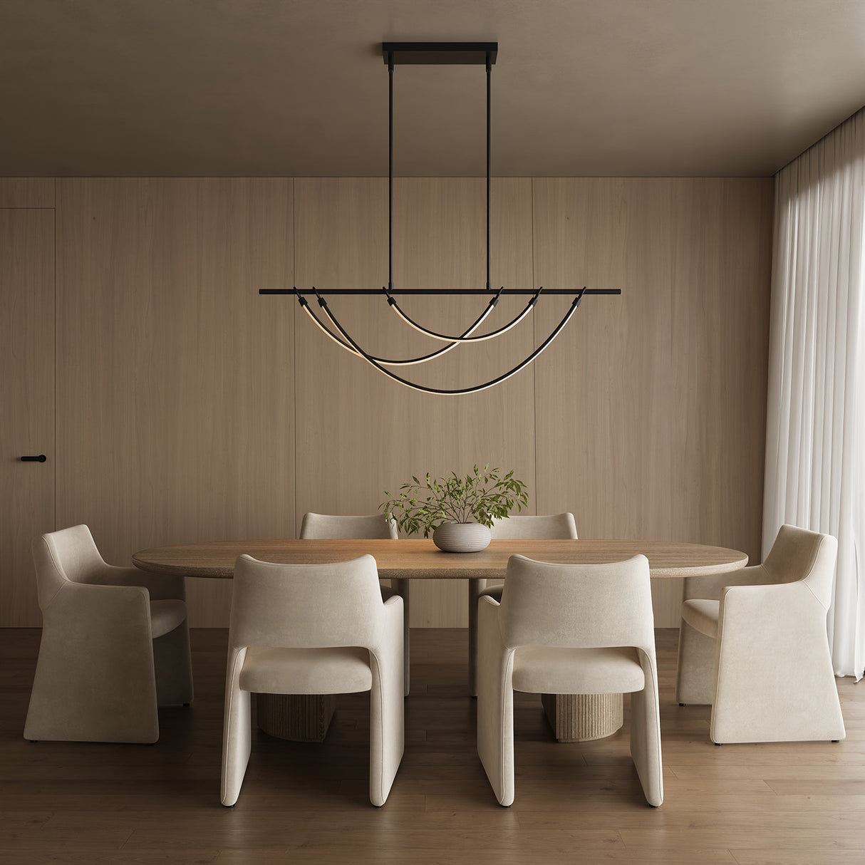 Modern dining room with an oval shaped wooden table and six suede chairs, featuring the Otis Linear LED 60" Pendant in Urban Bronze.