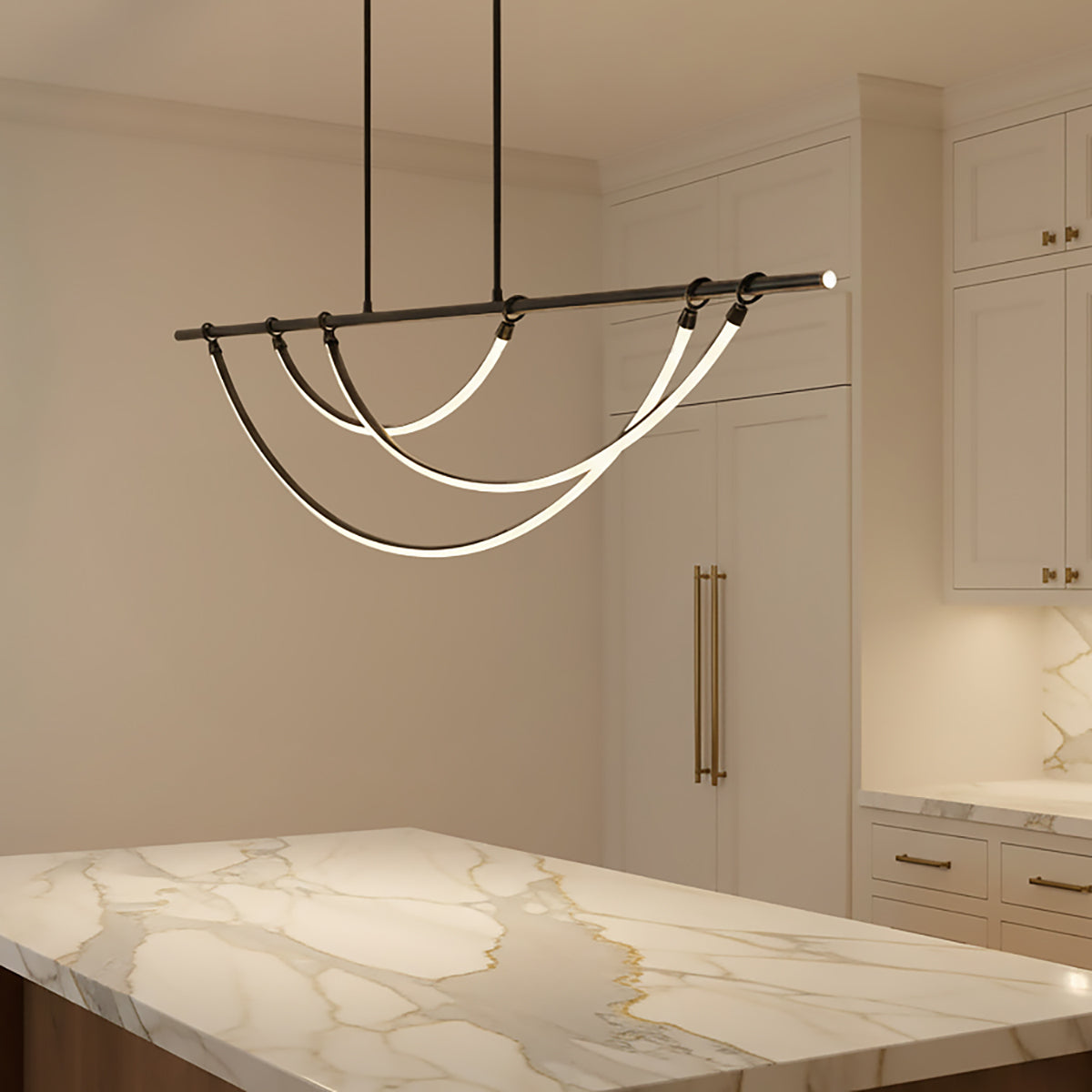 Otis Linear LED Pendant 60, Urban Bronze - A modern linear pendant hangs above a marble countertop in a kitchen.