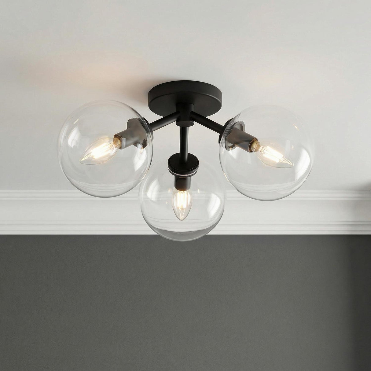 Gurt 3 Light Semi-Flush 18", Matte Black globe Flush Mount in a Contemporary Hallway with white crown molding and gray walls.