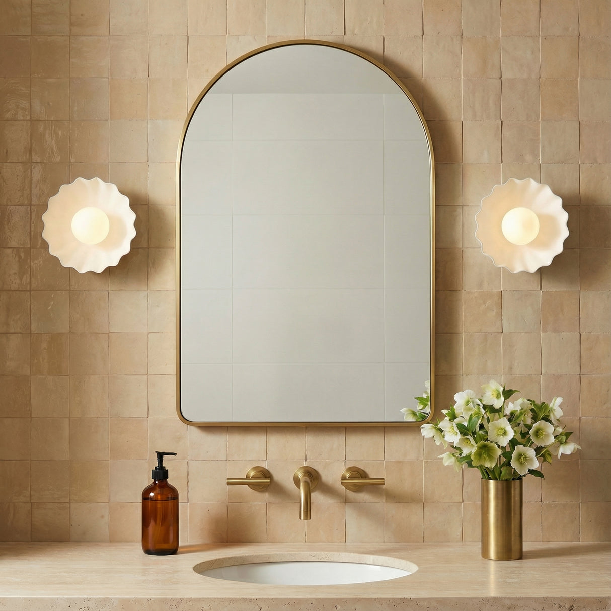 Flare LED Sconce 10", Antique White and Opal Glass scalloped wall sconce in a Mediterranean Bathroom with brass arch mirror and travertine countertop.