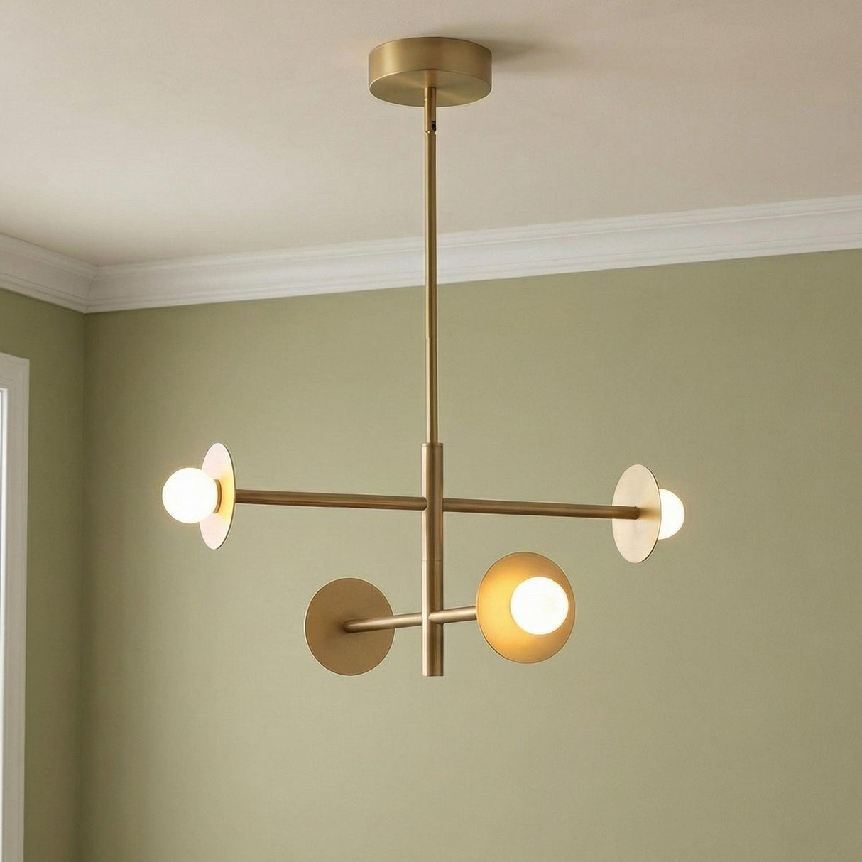 Sol LED Chandelier 23", Brushed Brass geometric chandelier in a Mid-Century Living Room with sage green walls.