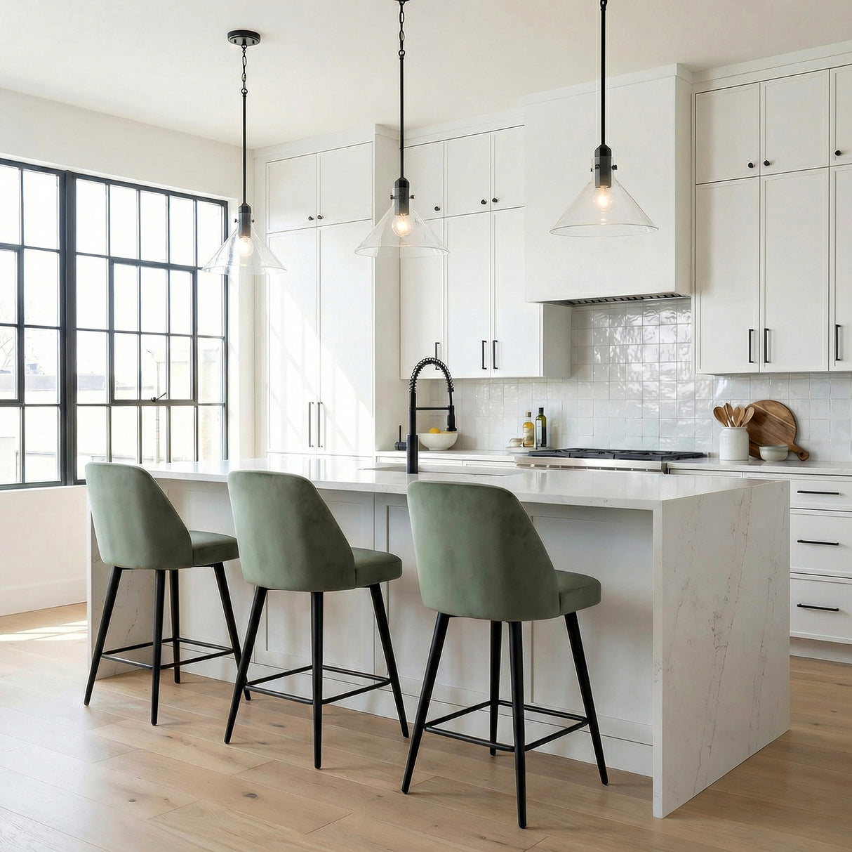 Nash Pendant 14”, Matte Black geometric Pendant in a Modern Kitchen with a white marble island and green velvet stools.