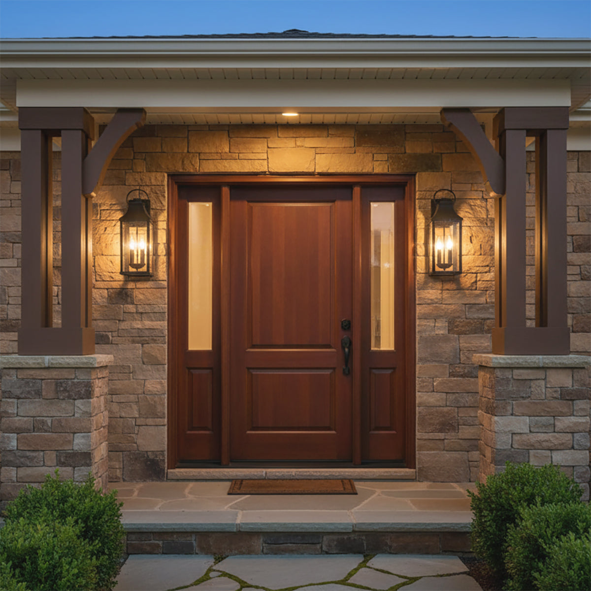 Ainsley Outdoor Wall Light, Medium 21" Black - Two outdoor wall lights flank a wood front door with glass side panels