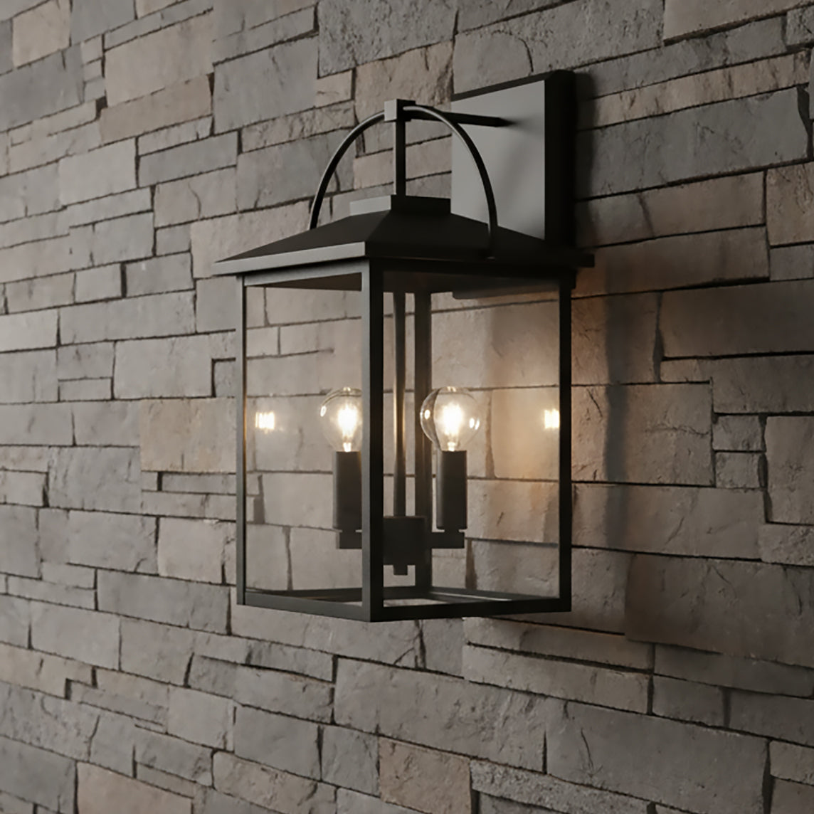 Darby Outdoor Wall Light, Small 17" tall in Black, shown against a stone exterior wall.
