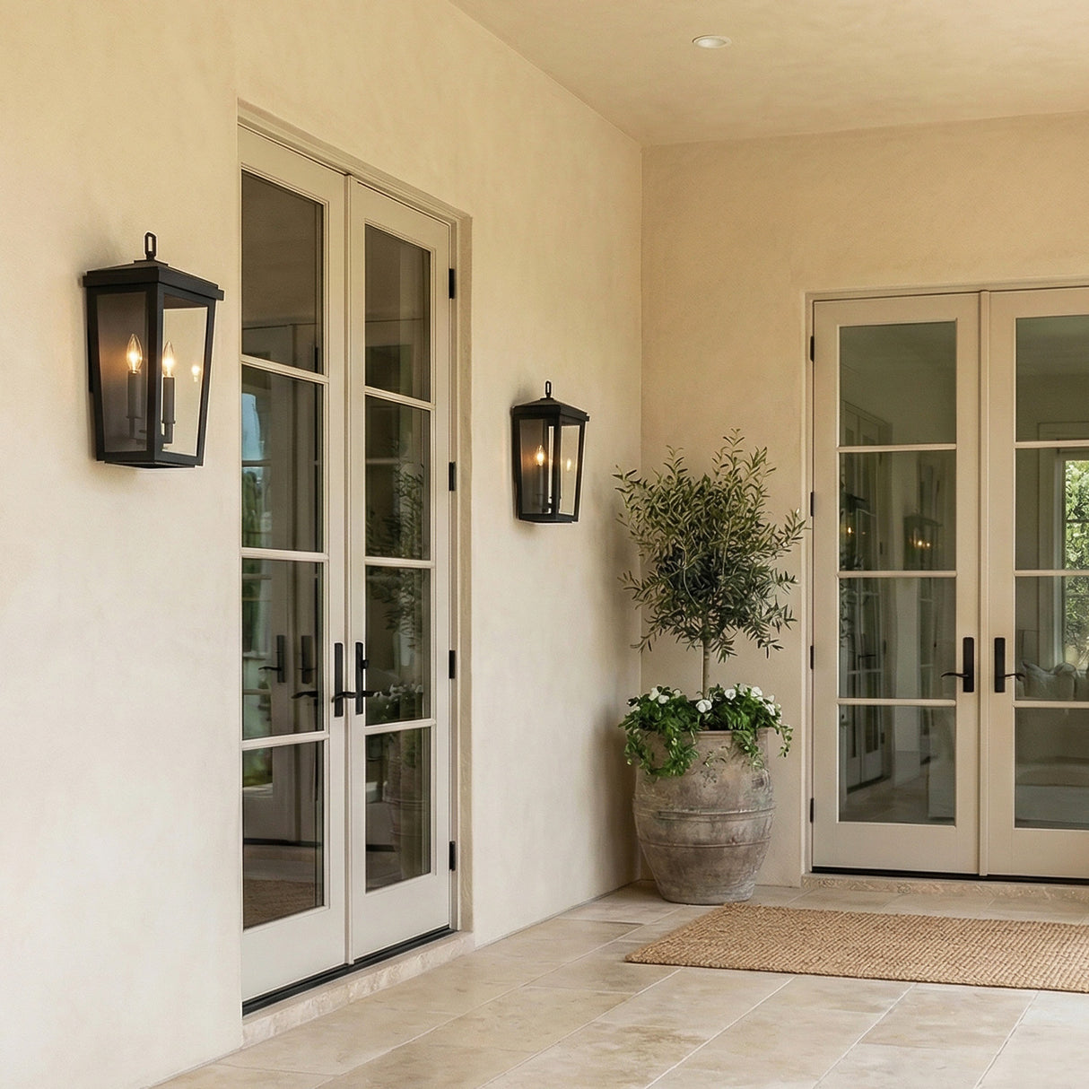 Leighton Outdoor Wall Light, Medium 18" Black geometric Outdoor Wall in a Mediterranean Outdoor with a potted olive tree.