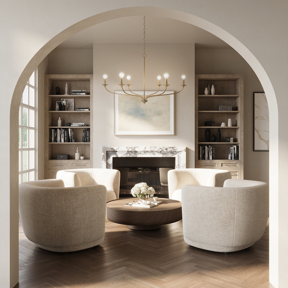 Oriana 6 Light Chandelier 40", Matte Brass is hung in a sitting room with four swivel chairs and white oak herringbone floors.